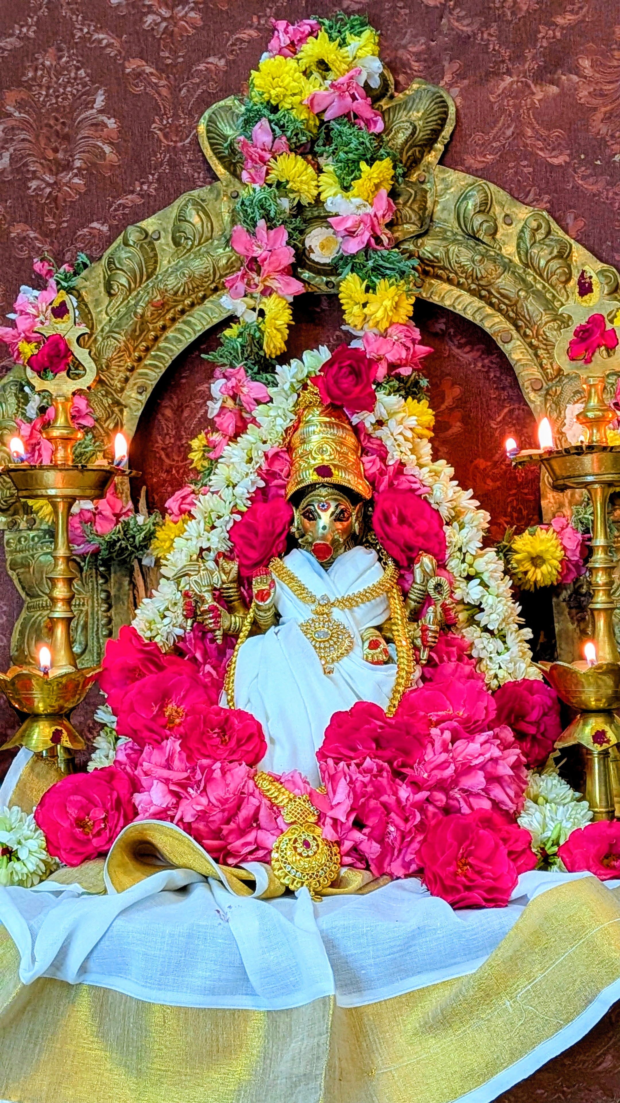 Goddess Varahi murti in white saree at the altar